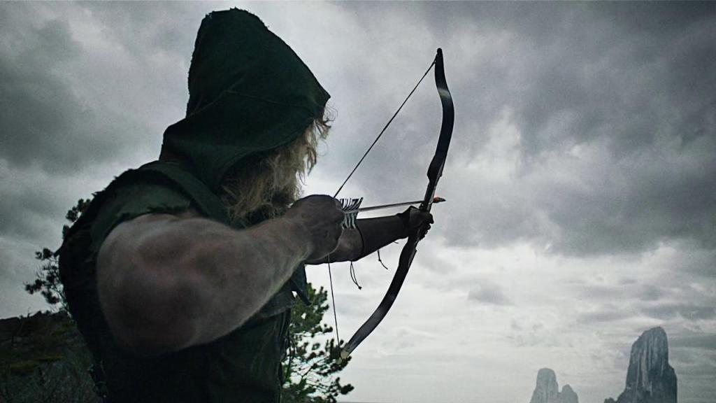 Oliver Queen (played by Stephen Amell) shooting an arrow on the island in the pilot episode of "Arrow"